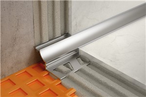 Schluter-DILEX-AHK features a single trapezoid-perforated anchoring leg, which is secured in the mortar bond coat and a cove section that forms the visible surface. The profile?s 3/8&quot; (10 mm) radius makes DILEX-AHK an attractive option for countertop/backsplash transitions, as it prevents the accumulation of dirt and makes cleaning simple. The profile separates tile fields that meet at inside corners where limited movement is expected. DILEX-AHK prevents surface water penetration and meets the maintenance a