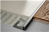 Schluter-DILEX-BWA features a trapezoid-perforated anchoring leg, made of recycled rigid PVC, which is secured in the mortar bond coat, and a dovetailed channel, made of recycled rigid PVC, which can be bonded to fixed building elements (e.g., door and window frames, bathtubs and shower trays, countertops, etc.) using Schluter-KERDI-FIX, epoxy resin, silicone, tile adhesive, etc. The profile isolates the tile covering from the structure and accommodates movement via the 3/16&quot; (5 mm)-wide soft chlorinated polyethylene (CPE) movement zone, which also forms the visible surface. The lower CPE movement zone is slit to maximize the absorption of movement. DILEX-BWA also prevents sound bridges, making it ideal for transitions in sound-rated floors.