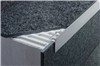 Schluter-SCHIENE-STEP is a finishing and edging profile for ceramic tile and natural stone installations on countertops, stairs, and tile over tile applications on walls. The profile features a trapezoid-perforated anchoring leg, which is secured in the mortar bond coat beneath the tile. The top of the profile features a vertical wall section that finishes and protects the tile from damage, while the vertical leg covers the edge of the subassembly, top of the riser, or existing wall tile edge.